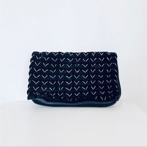 Motif leather clutch With leather and gold woven flap